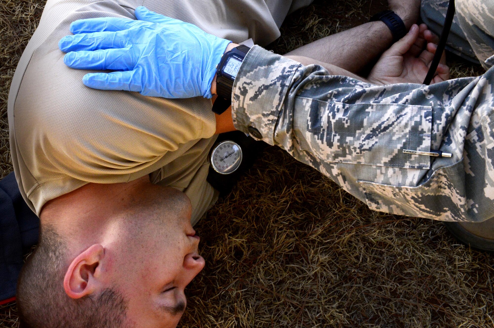 Emergency medical technicians assigned to Minot Air Force Base, N.D., treat a patient in a simulated hyperthermia scenario during the 2016 EMT Rodeo Aug. 26, 2016 at Cannon Air Force Base, N.M. Cannon’s EMT Rodeo tests the skills of medical professionals from across the Air Force through a series of innovative, high-pressure scenarios. (U.S. Air Force photo by Tech. Sgt. Manuel J. Martinez)