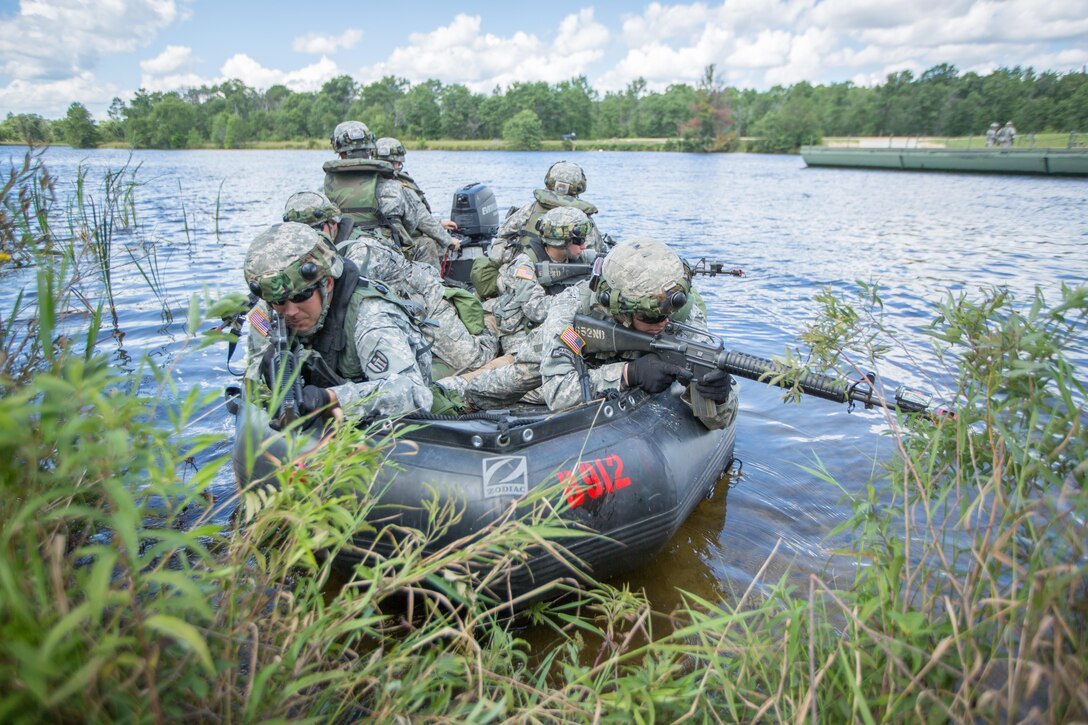 U.S. Army Soldiers of the 652nd Engineer Company, Ellsworth, Wis., and the 739th Engineer Company, Granite City, Ill., secure a shoreline of Big Sandy Lake for Ribbon Bridge operations during Combat Support Training Exercise (CSTX) 86-16-03 at Fort McCoy, Wis., August 14, 2016. The 84th Training Command’s third and final Combat Support Training Exercise of the year hosted by the 86th Training Division at Fort McCoy, Wis. is a multi-component and joint endeavor aligned with other reserve component exercises. (U.S. Army photo by Spc John Russell/Released)