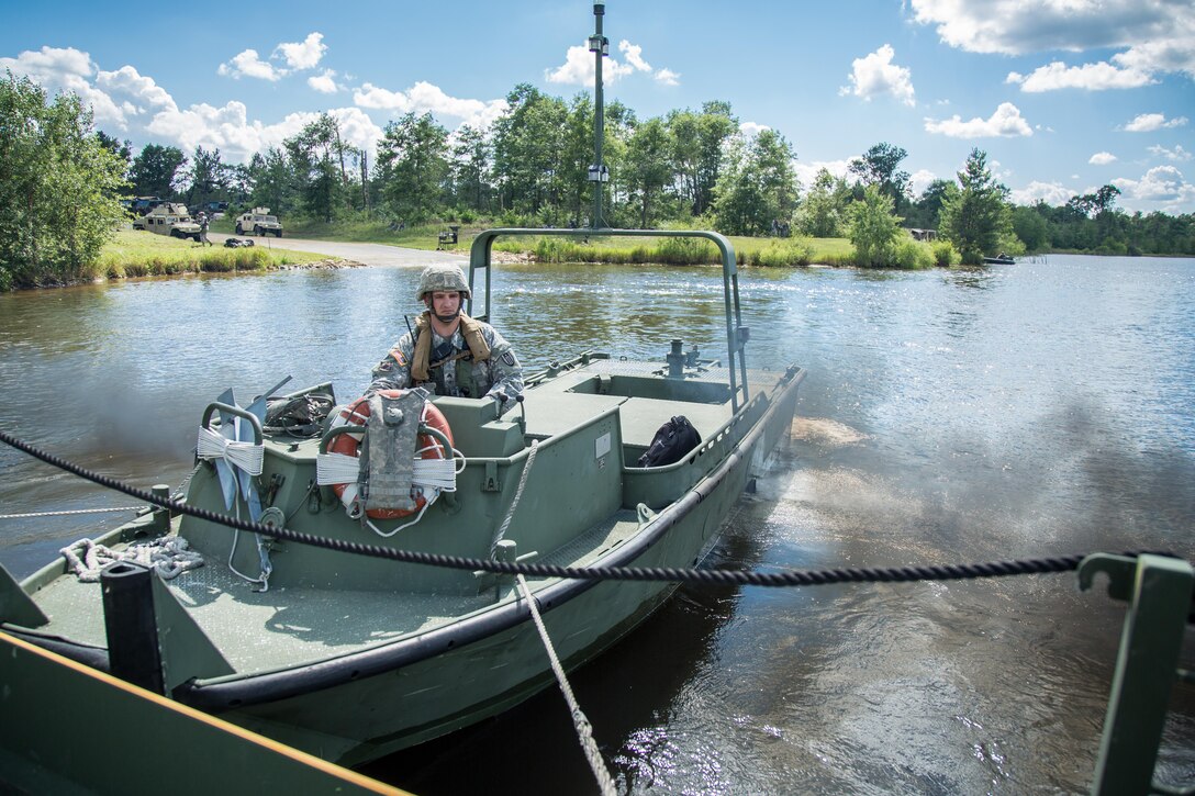 U.S. Army Sgt. Cody Dobbs, 739th Engineer Company, Granite City, Ill., uses a MK2 Bridge Erection Boat in support of Ribbon Bridging operations on Big Sandy Lake during Combat Support Training Exercise (CSTX) 86-16-03 at Fort McCoy, Wis., August 14, 2016. The 84th Training Command’s third and final Combat Support Training Exercise of the year hosted by the 86th Training Division at Fort McCoy, Wis. is a multi-component and joint endeavor aligned with other reserve component exercises. (U.S. Army photo by Spc John Russell/Released)