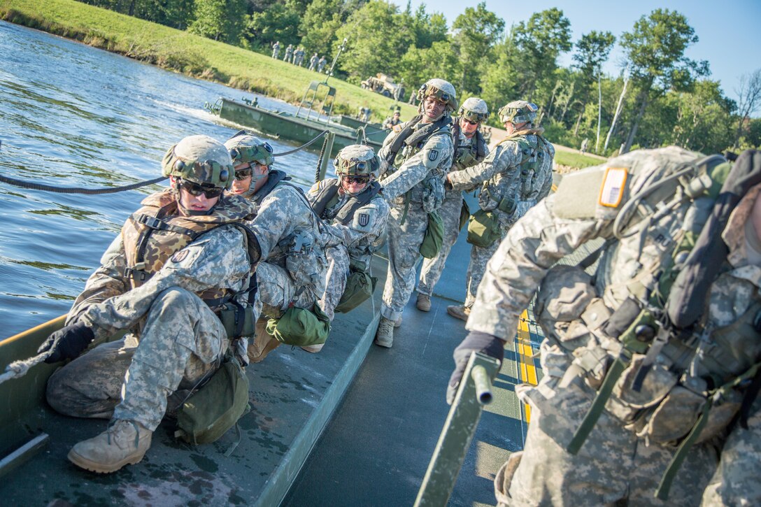 U.S. Army Soldiers of the 52nd Engineer Company, Ellsworth, Wis., and the 739th Engineer Company, Granite City, Ill., construct a Ribbon Bridge on Big Sandy Lake during Combat Support Training Exercise (CSTX) 86-16-03 at Fort McCoy, Wis., August 14, 2016. The 84th Training Command’s third and final Combat Support Training Exercise of the year hosted by the 86th Training Division at Fort McCoy, Wis. is a multi-component and joint endeavor aligned with other reserve component exercises. (U.S. Army photo by Spc John Russell/Released)