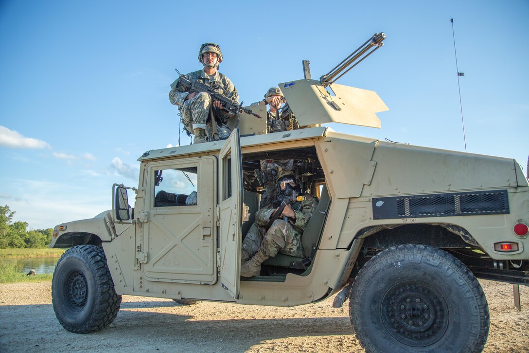 U.S. Army Spc. Kamalpreet Singh (Top), 805th Military Police Company, Cary, N.C., and Spc. Lauren Aguilar, 724th Military Police Company, Fort Lauderdale, Fla., pull security after a hostile engagement on Big Sandy Lake during Combat Support Training Exercise (CSTX) 86-16-03 at Fort McCoy, Wis., August 14, 2016. The 84th Training Command’s third and final Combat Support Training Exercise of the year hosted by the 86th Training Division at Fort McCoy, Wis. is a multi-component and joint endeavor aligned with other reserve component exercises. (U.S. Army photo by Spc John Russell/Released)