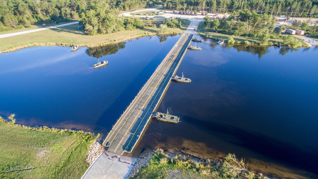 U.S. Army Soldiers of the 652nd Engineer Company, Ellsworth, Wis., and the 739th Engineer Company, Granite City, Ill., construct a Ribbon Bridge on Big Sandy Lake during Combat Support Training Exercise (CSTX) 86-16-03 at Fort McCoy, Wis., August 14, 2016. The 84th Training Command’s third and final Combat Support Training Exercise of the year hosted by the 86th Training Division at Fort McCoy, Wis. is a multi-component and joint endeavor aligned with other reserve component exercises. (U.S. Army photo by Spc John Russell/Released)