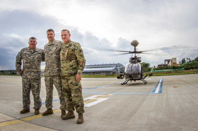U.S. Army I Corps officers Col. Michael Harvey, Chief Warrant Officer Jim Israel, and Chief Warrant Officer 4 Rian Demery pose in front of an OH-58D Kiowa Warrior at an airfield in Yongin, South Korea, Aug. 29, 2016. Together the men have 70 years of experience flying for the Army - and all three of them flew the OH-58. The helicopter belonged to the 1st Squadron, 17th Cavalry Regiment, the last squadron of OH-58's. Once the 1-17th's current rotation is over the Army will retire all OH-58's from its fleet. (U.S. Army photo by Staff Sgt. Ken Scar)