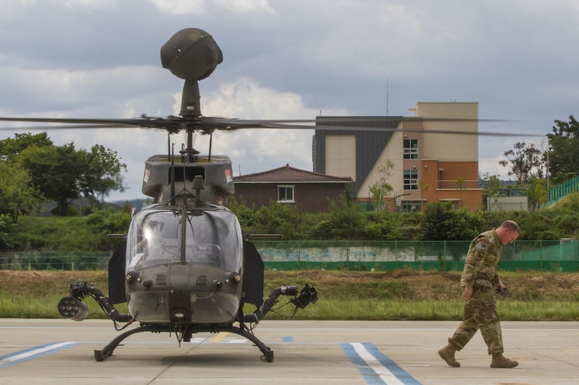 U.S. Army Col. Michael Harvey, executive officer to the commanding general of I Corps, exits an OH-58D Kiowa Warrior helicopter at an airfield in Yongin, South Korea, Aug. 29, 2016. The helicopter belonged to the 1st Squadron, 17th Cavalry Regiment, the last squadron of OH-58's. Once their deployment is over the Army will permanently retire them. Harvey logged more than 1,900 hours flying the aircraft during his Army career. (U.S. Army photo by Staff Sgt. Ken Scar)