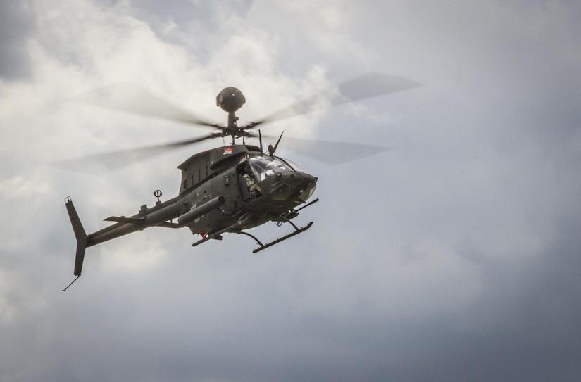 An OH-58D Kiowa Warrior carrying U.S. Army Col. Michael Harvey, executive officer to the commanding general of I Corps, flies over an airfield in Yongin, South Korea, Aug. 29, 2016. Harvey logged more than 1,900 flight hours in the OH-58 during his Army career. The helicopter belonged to the 1st Squadron, 17th Cavalry Regiment - the last squadron of OH-58's. Once their deployment is over the Army will permanently retire them. (U.S. Army photo by Staff Sgt. Ken Scar)