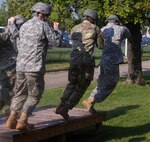 Soldiers of the 861st Quartermaster Company practice their landings on Saturday, Aug. 27, in Nashville, in preparation for an airborne jump later at Fort Campbell, Kentucky.