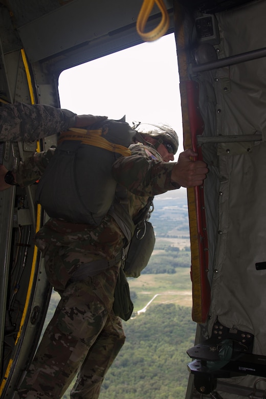 A jumpmaster  with the 861st Quartermaster Company conducts his safety checks from the C-130 door over Fort Campbell, Kentucky, on Saturday, Aug. 27.