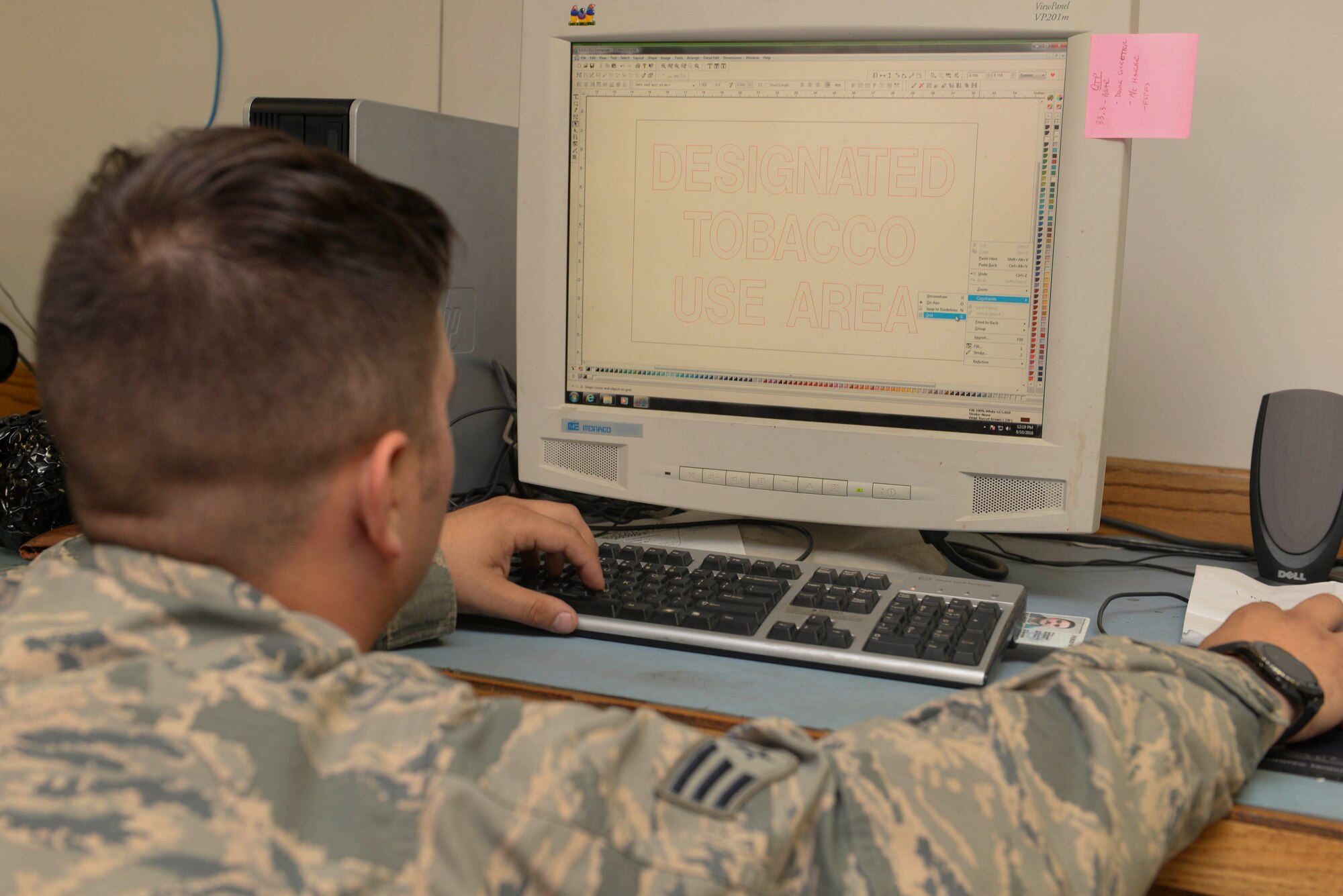 Senior Airman Michael Muldoon, a structural journeyman assigned to the 5th Civil Engineer Squadron, creates a sign for Northern Neighbors Day 2016 at Minot Air Force Base, N.D., Aug. 10, 2016. Muldoon helped create over 70 signs for the air show scheduled for Aug. 13. (U.S. Air Force photo/Airman 1st Class Jessica Weissman)
