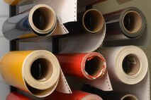 Rolls of vinyl sit in the 5th Civil Engineer Squadron sign shop at Minot Air Force Base, N.D., Aug. 10, 2016. The different colored rolls allow Airmen to create signs with more than one color for the base. (U.S. Air Force photo/Airman 1st Class Jessica Weissman)