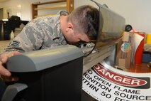 Senior Airman Michael Muldoon, a structural journeyman assigned to the 5th Civil Engineer Squadron, aligns a blade to properly cut a sign at Minot Air Force Base, N.D., Aug. 10, 2016. The 5th CES provides signs for all squadrons on base and missile alert facilities. (U.S. Air Force photo/Airman 1st Class Jessica Weissman)