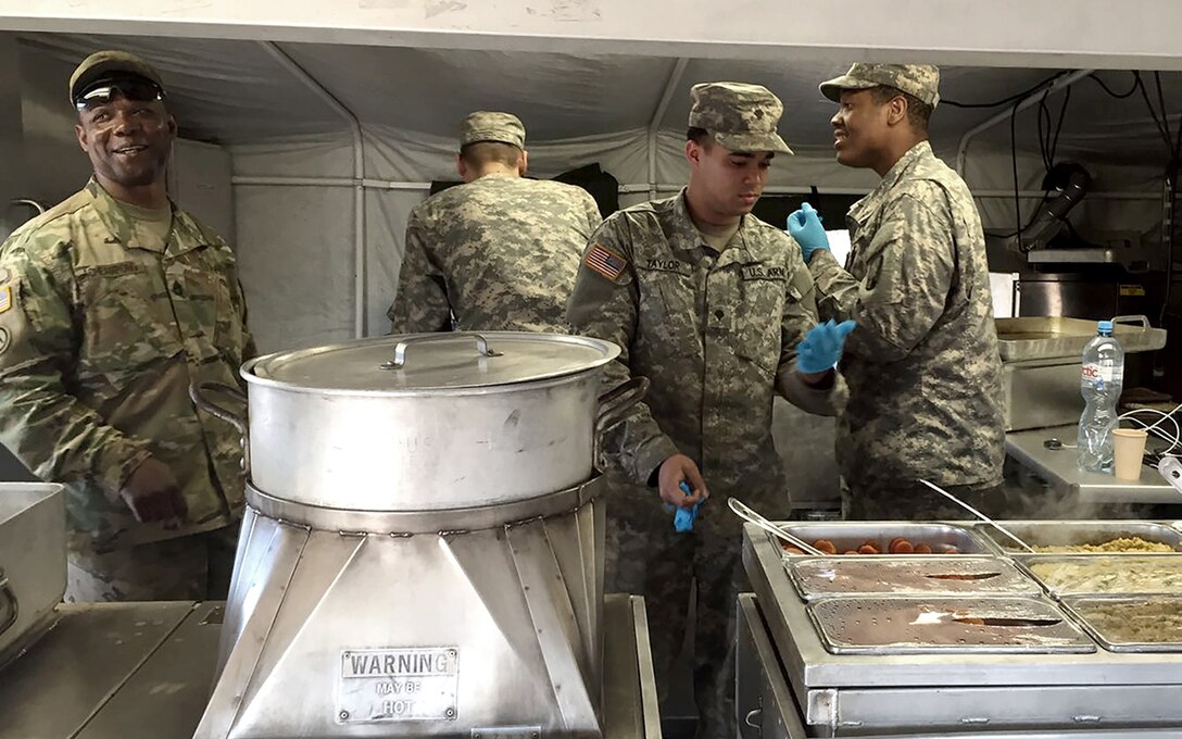 Army Sgt. 1st Class Ulysses Acheampong, Spc. Brenton Taylor and Spc. Jerome Payne used the 8-liter bottles from a secondary vendor for cooking and washing dishes during Anakonda-16. All soldiers are assigned to the 66th Transportation Company, 16 Sustainment Brigade, Kaiserslautern, Germany.