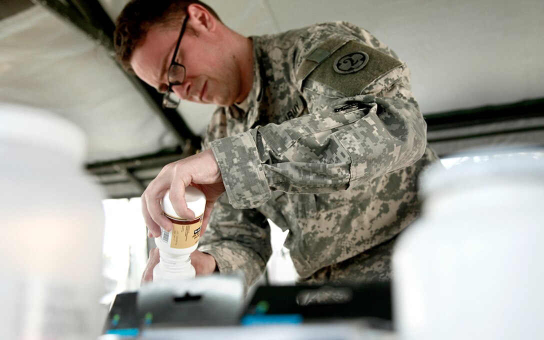 U.S. Army Sgt. Frisco Cleary, assigned to with the 396th Combat Support Hospital Company, condense medications in the pharmacy tent during a medical readiness exercise at San Padro, Guatemala, May 16, 2016.  Task Force Red Wolf and Army South conducts Humanitarian Civil Assistance Training to include tactical level construction projects and Medical Readiness Training Exercises providing medical access and building schools in Guatemala with the Guatemalan Government and non-government agencies from 05MAR16 to 18JUN16 in order to improve the mission readiness of US forces and to provide a lasting benefit to the people of Guatemala. 