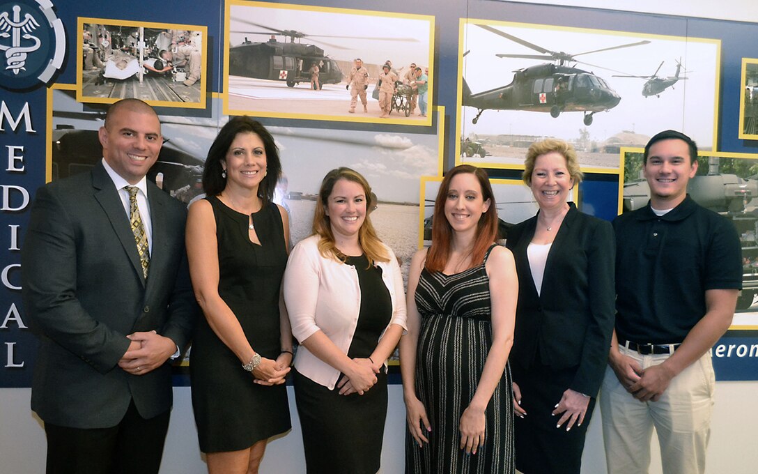 The DLA Troop Support Medical supply chain’s “dream team”: from left to right, Alexander Quinones, integrated supply team chief; Denise Taubman, Amanda Doherty, and Danielle Delaney, contracting officers; Joanne Marie Grace, acquisition specialist; and Christopher Newman, intern.