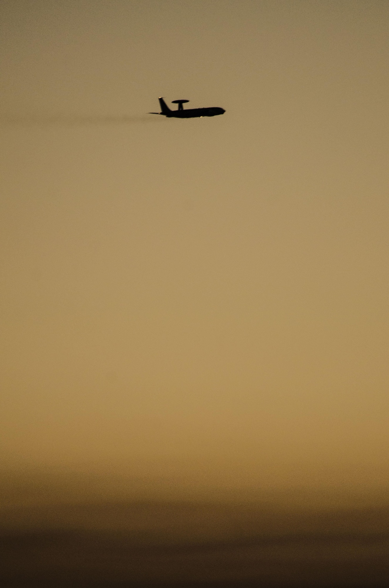 An E-3 Sentry assigned to the 965th Airborne Air Control Squadron, Tinker Air Force Base, Okla., flies at sunset during exercise Red Flag 16-4 at Nellis AFB, Nev., Aug. 17, 2016. The E-3 is a command and control battle management platform with a surveillance mission. (U. S. Air Force photo by Tech. Sgt. Frank Miller)