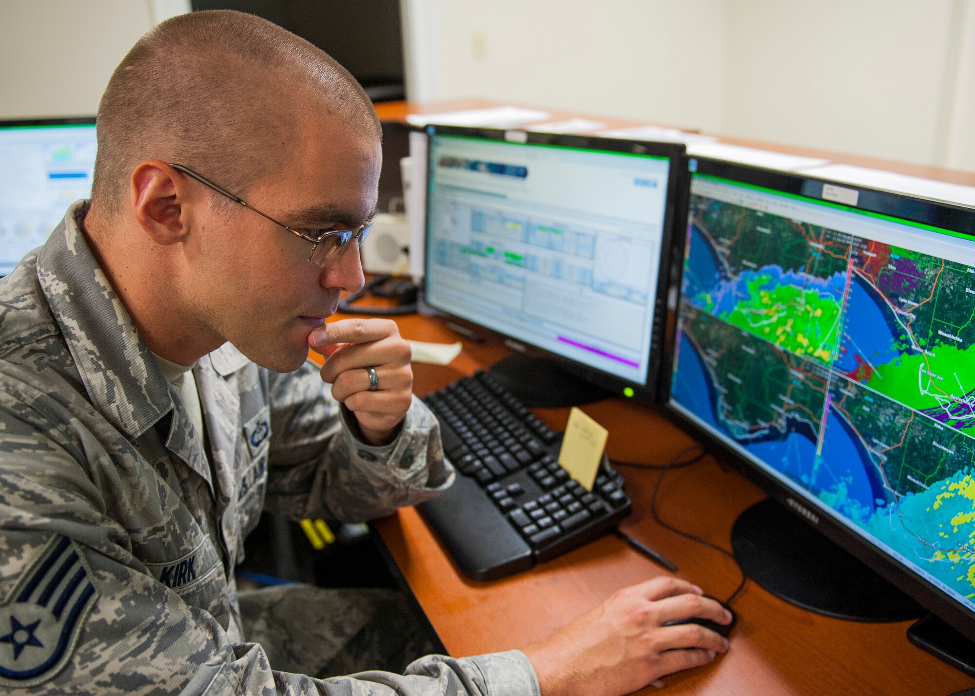 Staff Sgt. Andrew Kirk, 96th Weather Squadron, weather forecaster, watches the weather radar during Tropical Storm Hermine Sept. 1 at Eglin Air Force Base, Fla. Kirk evaluates thunderstorms for height, severity and their ability to produce lightning. This level of detailed observation ensures safe flight operations for military and commercial aircraft as well as the safety of all base units and personnel. The observations are performed every hour, every day and disseminated nationally and worldwide. (U.S. Air Force photo/Ilka Cole) 