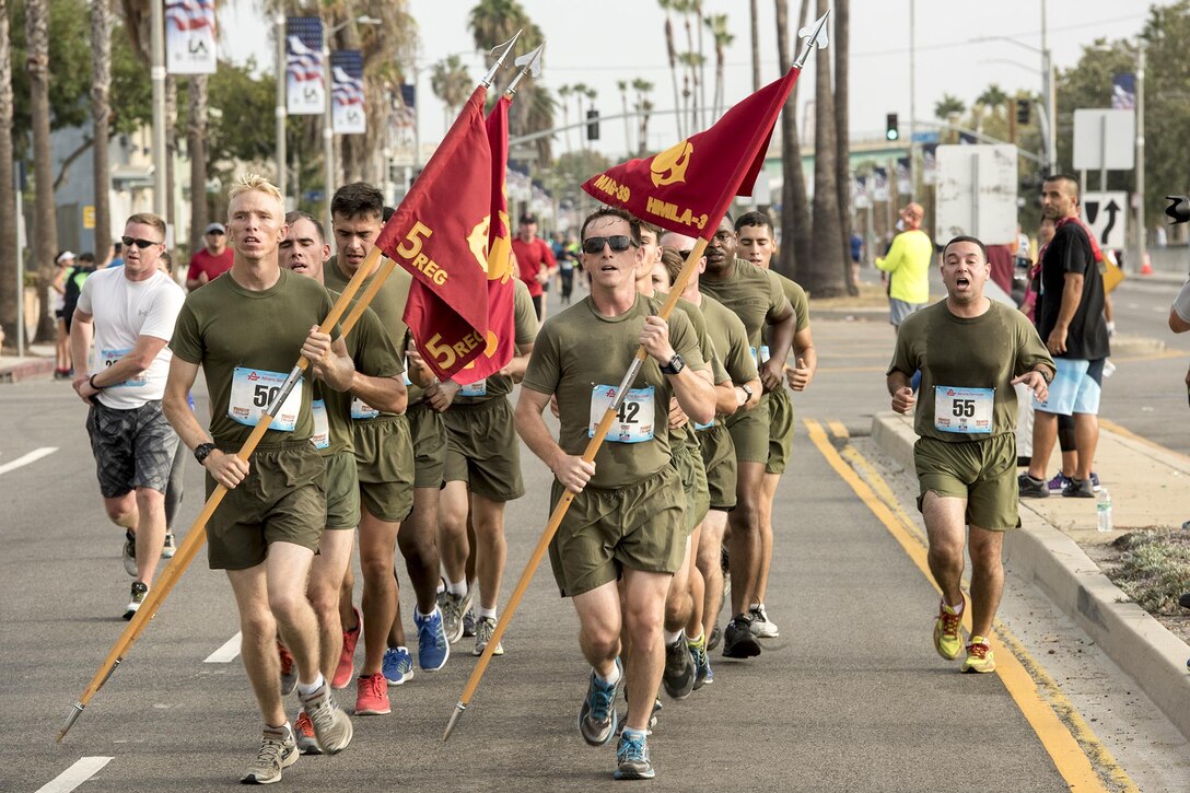 Marines move forward in formation at the Conquer the Bridge Run during Los Angeles Fleet Week near San Pedro, Calif., Sept. 5, 2016. The inaugural event offers the public an opportunity to tour ships, meet service members and better understand how the sea services support the U.S. national defense. Navy photo by Petty Officer Ryan B. Tabios
