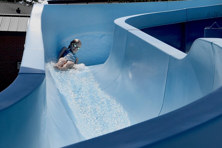 Belle Stidham, daughter of U.S. Air Force Staff Sgt. Jared Stidham, 38th Rescue Squadron, speeds down the water slide during the Labor Day “Splash Party,” Sept. 5, 2016, at Moody Air Force Base, Ga. Airmen and their families were able to enjoy the free event that included poolside games, music, free popsicles and door prizes. (U.S. Air Force photo by Staff Sgt. Brian J. Valencia)