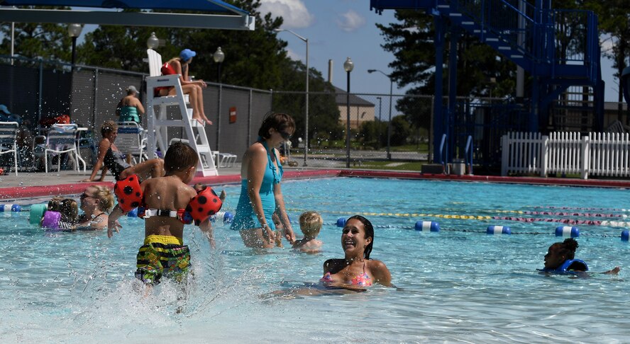 Airmen and their families enjoy a day at the pool during the Labor Day “Splash Party,” Sept. 5, 2016, at Moody Air Force Base, Ga. Labor Day is a federal holiday that pays tribute to the American workforce who serve as the backbone of this great nation. (U.S. Air Force photo by Staff Sgt. Brian J. Valencia)