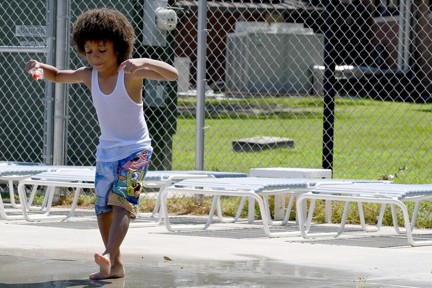 Jayce Jones, son of Julius Jones, 23d Force Support Squadron, busts a move to the DJ’s beats during the Labor Day “Splash Party,” Sept. 5, 2016, at Moody Air Force Base, Ga. The music played throughout the event allowing everyone a chance to show off their dancing skills. (U.S. Air Force photo by Staff Sgt. Brian J. Valencia)