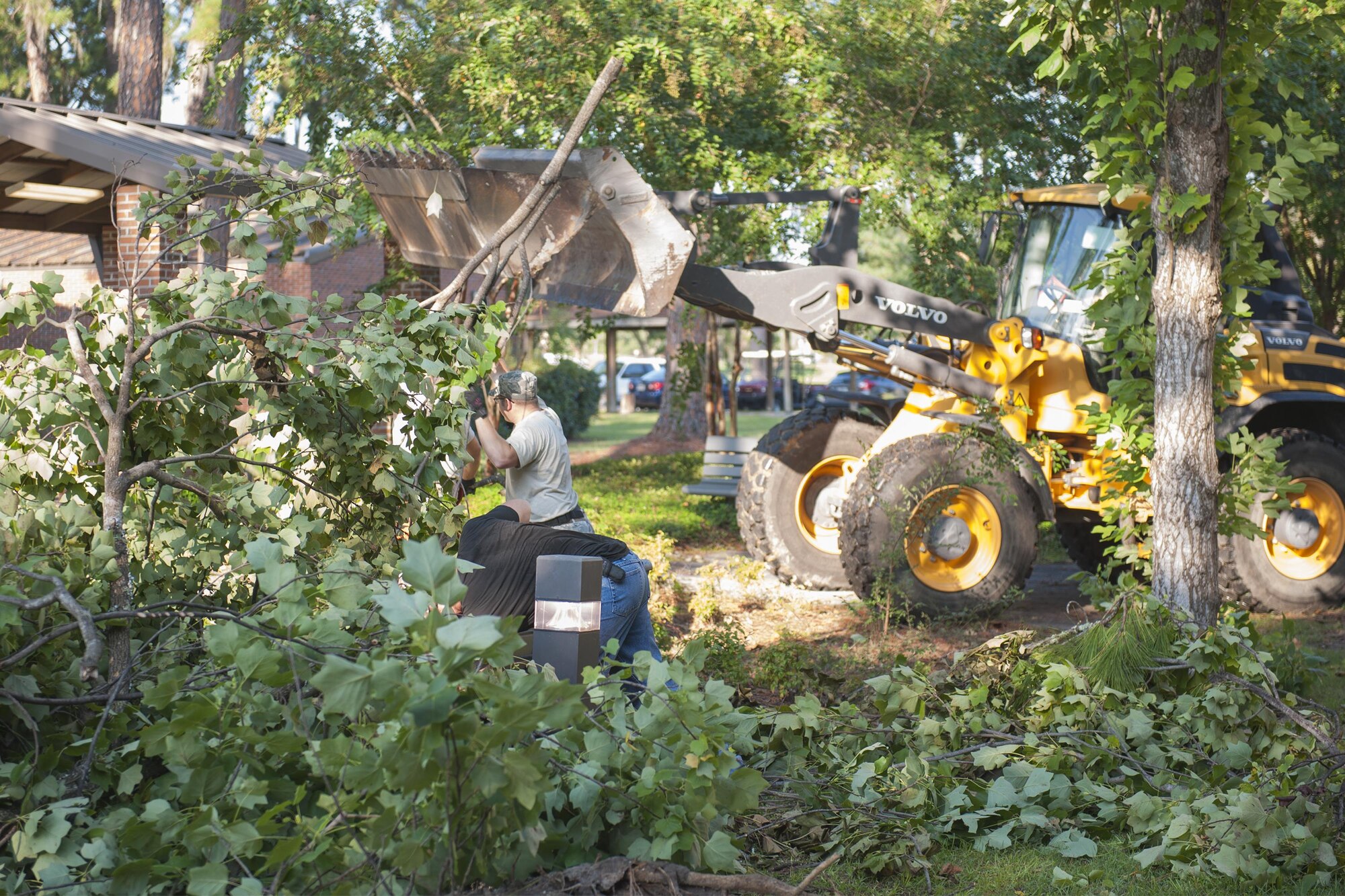 Members of the 23d Civil Engineer Squadron clear debris near Airmen’s dormitories, Sept. 6, 2016, at Moody Air Force Base, Ga. Fallen trees and debris were left behind after Tropical Storm Hermine struck with roughly 70 mph winds and heavy rains. (U.S. Air Force photo by Airman 1st Class Daniel Snider)