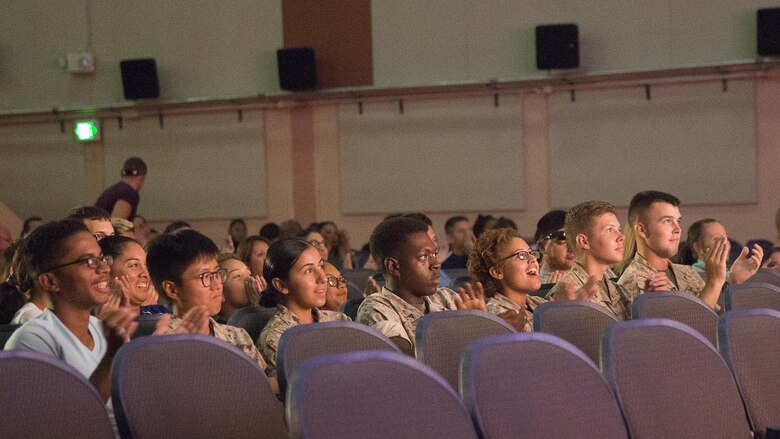 Marines in the audience applaud the participants of the Single Marines Program’s 7th Annual Marines Got Talent Show at the Sunset Cinema, Aug. 12, 2016. The event is held to give service members the opportunity to show their talent with the rest of the Combat Center community. (Official Marine Corps photo by Cpl. Thomas Mudd/Released)