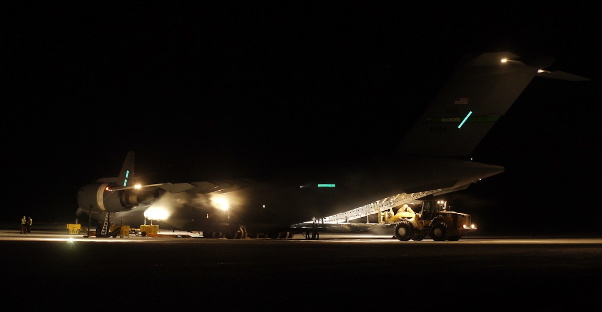 Cargo is off loaded from a McChord C-17 Globemaster III during WinFly Aug. 26, 2016 at McMurdo Station, Antarctica. The 62nd Airlift Wing crew was on the ice Aug. 26-27 for 4 hours to deliver advance teams and equipment for the upcoming main season of Operation Deep Freeze. (Courtesy photo)