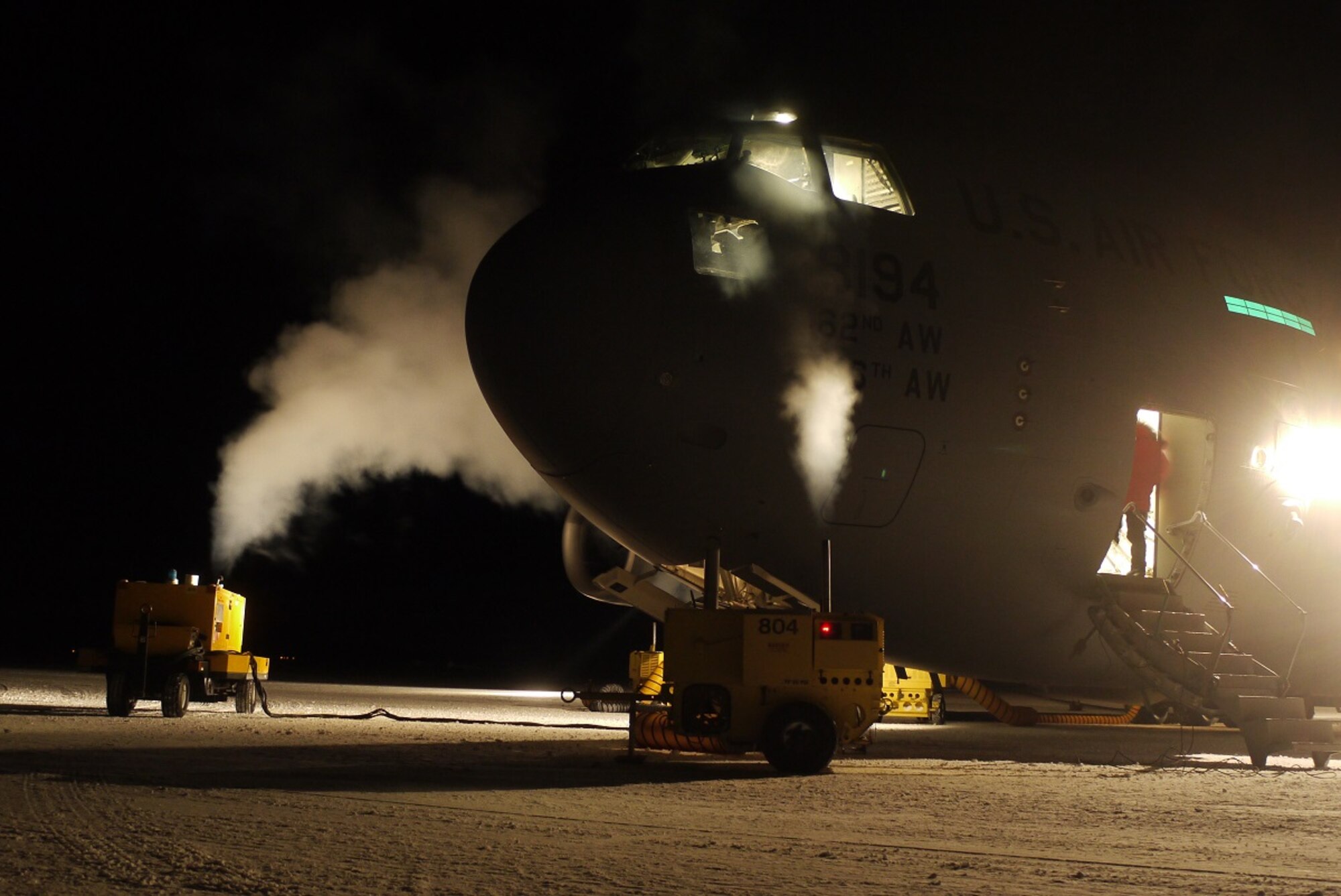 Aerospace ground equipment heaters, heats up a McChord C-17 Globemaster III during WinFly Aug. 27, 2016 at McMurdo Station, Antarctica. The temperature in Antarctica was -39C and the heaters were used to keep the aircraft and its systems functioning properly. The Air Force is uniquely equipped and trained to operate in such an austere environment and has provided support to U.S. Antarctic research since 1955. (Courtesy photo)