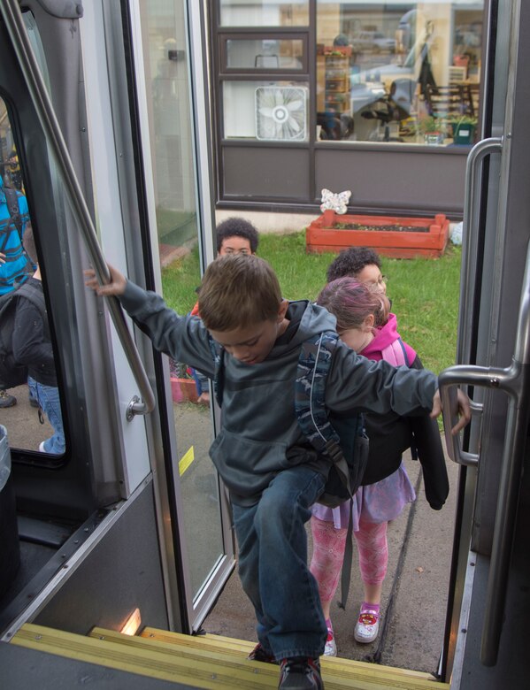 Ketchikan School Age Center students get on the bus on their way to school after being dropped off at the before-and-after school care programs for school-age children at Joint Elmendorf-Richardson, Alaska, Sept. 6, 2016. Ketchikan School Age Center roughly bused 150 students to and from school and provide before-and-after school care program for school-age children. (U.S. Air Force photo by Staff Sgt. Sheila deVera)
