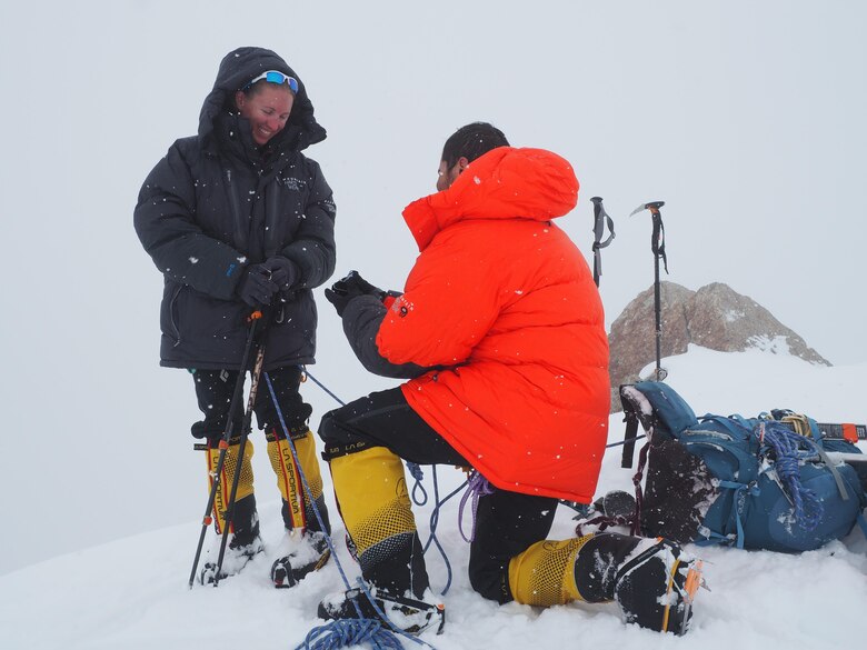 Capt. Stephen Austria, project engineer in the USACE-Alaska District's Foreign Military Sales Program, proposes to his girlfriend and climbing partner, Rebecca Melesciuc, at the "Edge of the World" overlook at 14,000-feet elevation on Denali.
