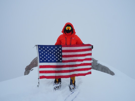 Capt. Stephen Austria, project engineer in the USACE-Alaska District's Foreign Military Sales Program, carried this American flag on his expedition climbing Denali this past summer. The flag was with Austria on every mission while deployed to Iraq. He said he hopes his climb helps raise Soldier suicide awareness. 