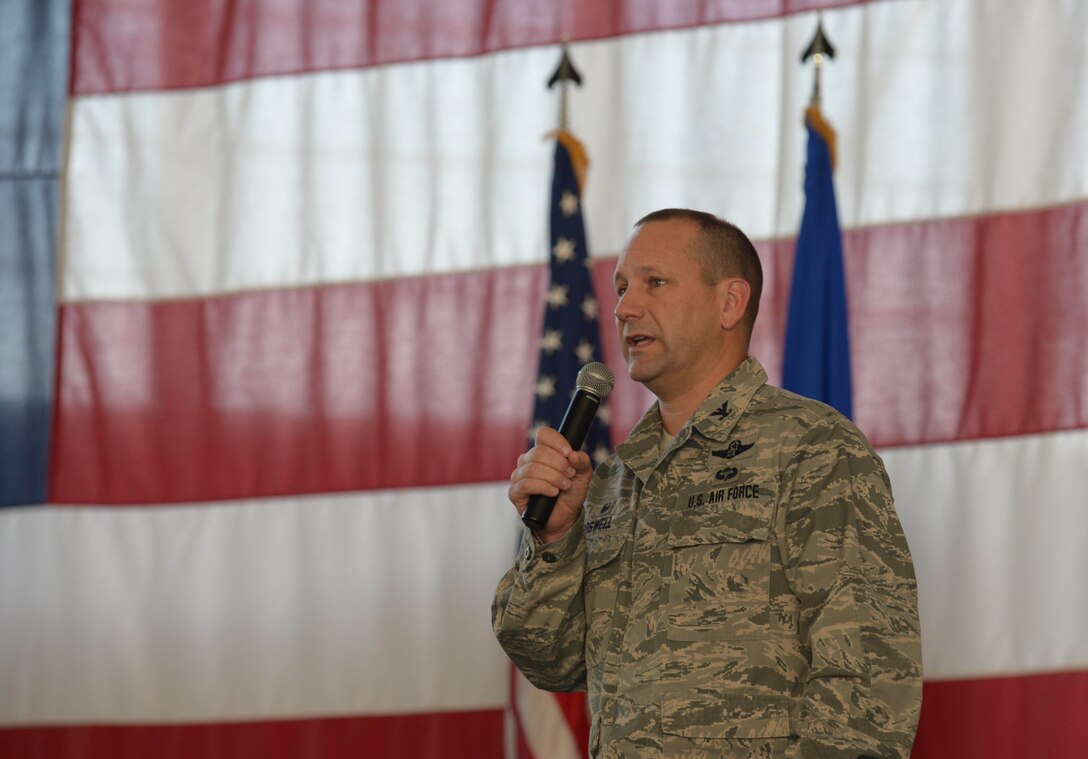 Col. Gentry Boswell, commander of the 28th Bomb Wing, spoke at a commander’s call in the Pride Hangar at Ellsworth Air Force Base, S.D., Sept. 1, 2016. Boswell highlighted recent wing successes and encouraged Airmen take advantage of the Labor Day weekend to recharge for the future. (U.S. Air Force photo by Airman 1st Class Donald C. Knechtel)