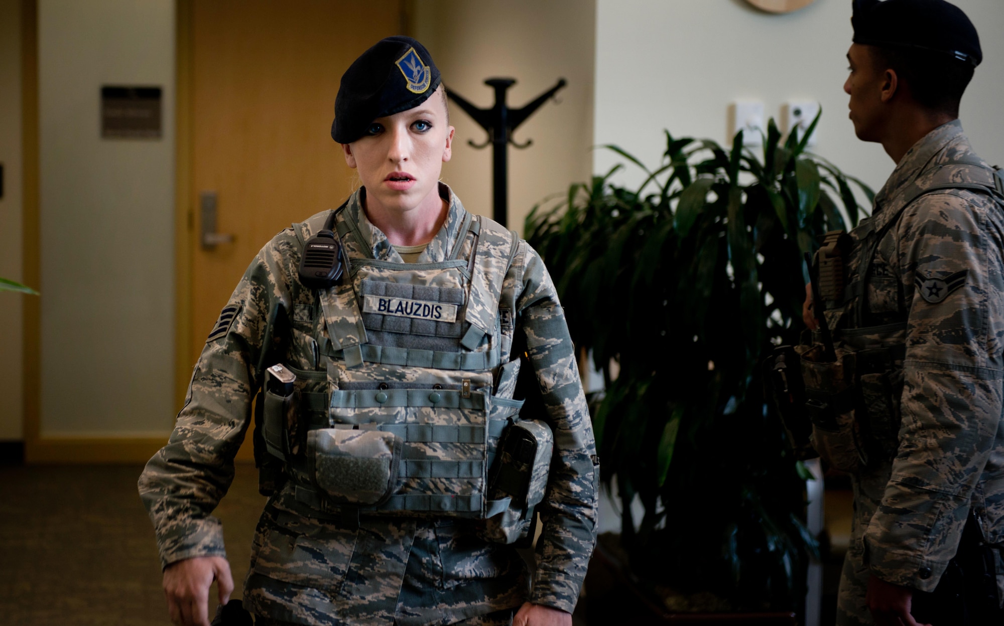 Air Force Staff Sgt. Chelsea Blauzdis, 673d Security Forces patrolman, walks toward the entrance of the 673d Medical Group Mental Health Flight during a patient-under-duress exercise Aug. 24, 2016. The exercise served the dual purpose of training Mental Health Flight as well as the security forces personnel on how to respond to it. (U.S. Air Force photo by Senior Airman Kyle Johnson)