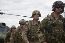 Members from the 40th Helicopter Squadron, the 741st Missile Security Forces Squadron and 15th and 19th Air Operations Support Squadron Tactical Air Control Party walk away from a UH1-N1 Iroquois helicopter after completing ground training Aug. 25, 2016, at Malmstrom Air Force Base, Mont. Five TACP members worked with Airmen from Malmstrom on day and night ground training over a four-day period. (U.S. Air Force photo/Staff Sgt. Delia Marchick)