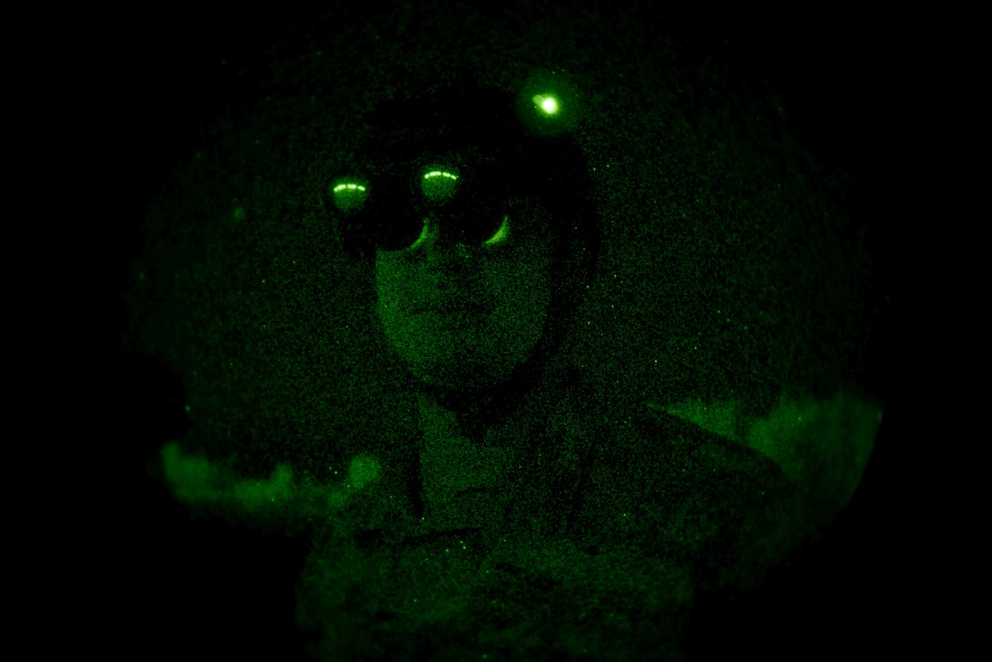 Tech Sgt. Daniel Marchick waits to hear back from the opposing forces team while conducting night training Aug. 25, 2016, at Malmstrom Air Force Base, Mont. Marchick worked with members from the 40th Helicopter Squadron, the 741st Missile Security Forces Squadron and Tactical Air Control Party to advance joint tactics and nuclear security. (U.S. Air Force photo/Staff Sgt. Delia Marchick)
