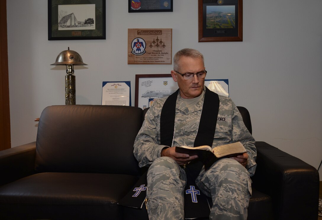 Chap. (Maj.) David Knight, the base chaplain assigned to the 28th Bomb Wing, reads his bible in his office at Ellsworth Air Force Base, S.D., August 31, 2016. During Knight’s 14 years as an Air Force chaplain, he has been deployed four times, provided memorial services for approximately 80 troops killed in action and 1,600 patients who were wounded in action during his Operations Enduring Freedom and Iraqi Freedom deployments, as well as being named the 2005 Edwin Chess Award Winner (Company Grade Officer Chaplain of the Air Force). (U.S. Air Force photo by Airman 1st Class Denise M. Jenson)