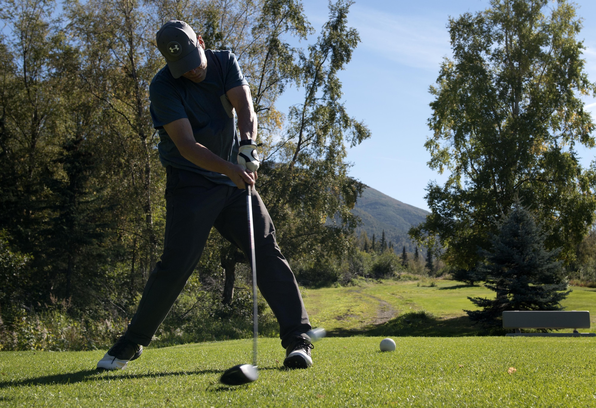 Kevin Armstrong, from Palmer, Alaska, takes his first swing of the hole at Moose Run golf course, Sept. 1. Moose Run is open in the summer to military members as well as the community at large and offers a variety of competitions and tournaments throughout the season. (U.S. Air Force photo by Senior Airman Kyle Johnson)