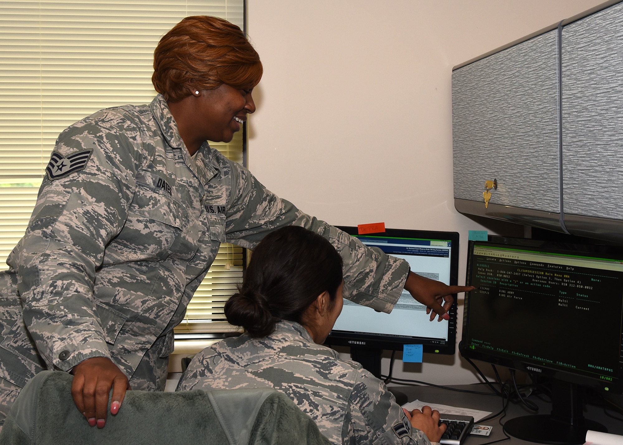 SSgt. Patricia Dates assists a young airmen with a financial question Sep. 1, 2016 at Warfield Air National Guard Base, Middle River, Md. Dates is the Maryland Air National Guard September Spotlight Airman. (U.S. Air National Guard photo by Airman 1st Class Enjoli Saunders/RELEASED)

