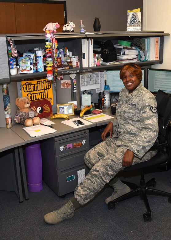 SSgt. Patricia Dates poses at her desk in the finance unit Sept. 1, 2016 at Warfield Air National Guard Base, Middle River, Md. Dates is the Maryland Air National Guard September Spotlight Airman. (U.S. Air National Guard photo by Airman 1st Class Enjoli Saunders/RELEASED)