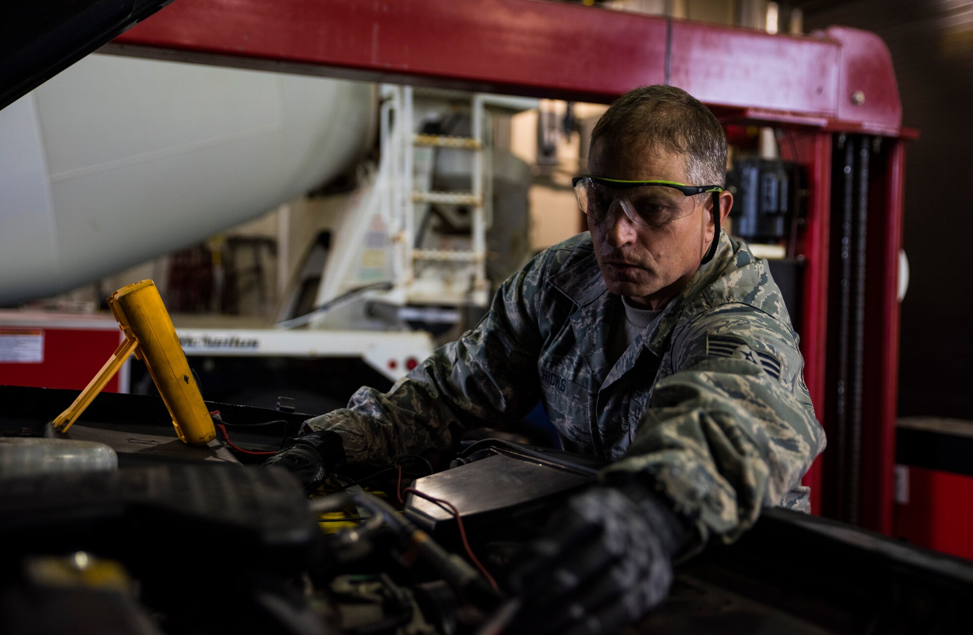 Tech. Sgt. Lloyd Hicks, general purpose vehicle mechanic supervisor, provides routine maintenance to a truck Sept. 1, 2016, at Ebbing Air National Guard Base, Fort Smith, Ark. Hicks has been selected as the Flying Razorback Spotlight for September. (U.S. Air National Guard photo by Senior Airman Cody Martin)