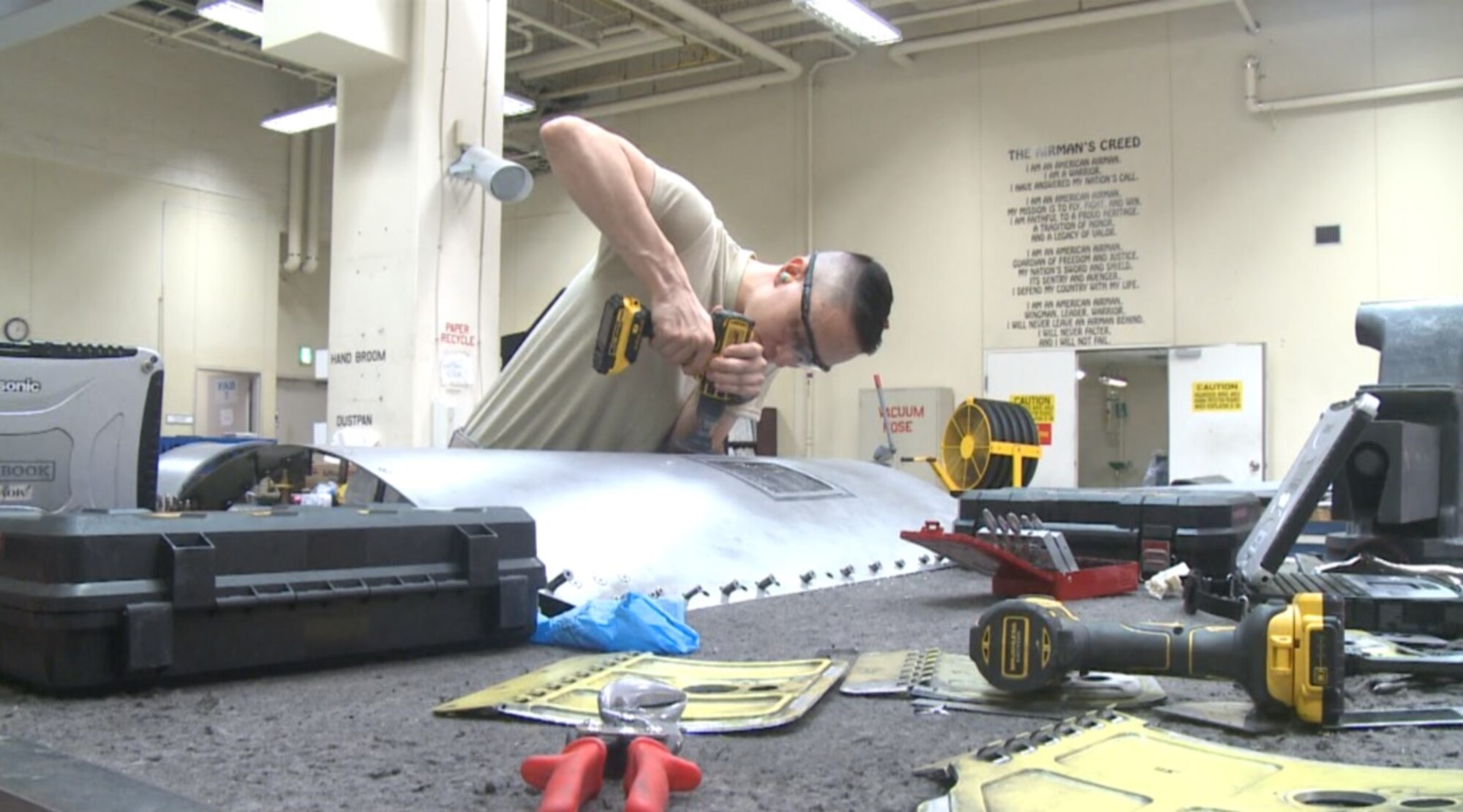U.S. Air Force Airman 1st Class Issak Sainz, an aircraft structural maintenance journeyman with the 35th Maintenance Squadron, sands the skin of an F-16 Fighting Falcon fuselage at Misawa Air Base, Japan, Sept. 01, 2016. Sainz ensures aircraft stay mission capable by providing them with the structural integrity and rigidity they need to withstand flight thousands of feet above sea level. . (U.S. Air Force photo by Senior Airman Jarrod Vickers)