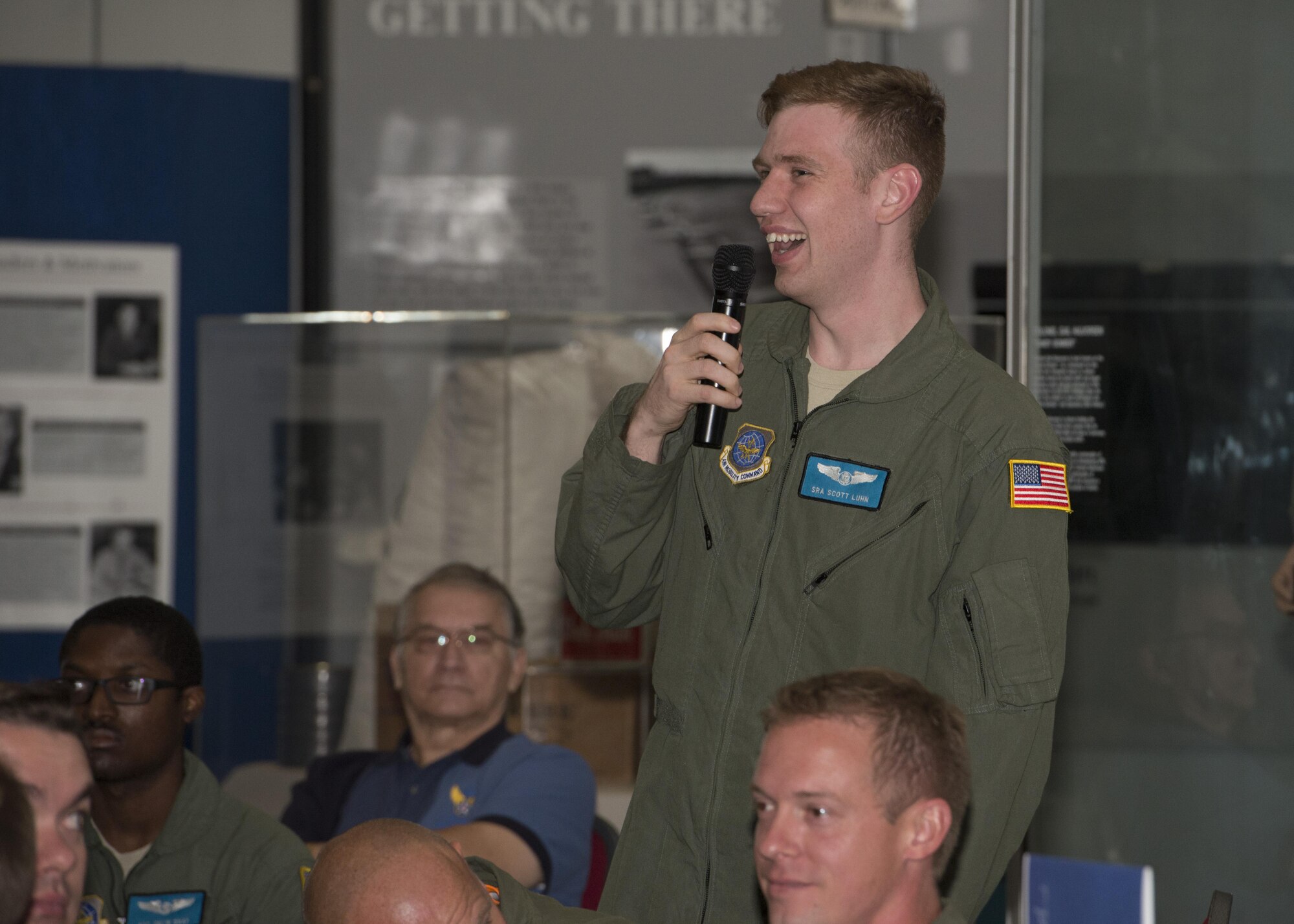 Senior Airman Scott Luhn, 9th Airlift Squadron loadmaster, asks retired Gen. Arthur “Art” Lichte, Airlift/Tanker Association chairman, left, and retired Chief Master Sgt. Michael Kerver, A/TA president, a question at an A/TA professional development panel Aug. 26, 2016, at the Air Mobility Command Museum on Dover Air Force Base, Del. The panel was open to the audience to ask questions. (U.S. Air Force photo by Senior Airman Zachary Cacicia)