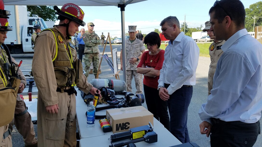 Cpl. Jeremy Golden, a team leader with Search and Extraction Platoon, Reaction Force Company, Chemical Biological Incident Response Force, CBIRF, speaks to officials from the Israeli Ministry of Defense for chemical, biological, radiological and nuclear defense during an official visit Aug. 29, 2016. Golden explained how different equipment is used by Marines to rescue casualties in a contaminated environment and to protect individuals entering the “hot zone”.