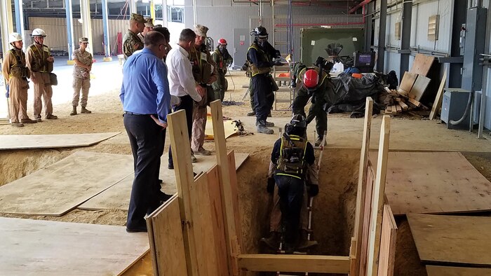 Retired Israeli Defense Force Brig. Gen. Moshe Edri, Assistant Minister of Defense for chemical, biological, radiological and nuclear defense,  Government of Israel, watches as Marines with Technical Rescue Platoon, Chemical Biological Incident Response Force, CBIRF, demonstrate rescuing a casualty from a trench in a contaminated environment during an official visit Aug. 29, 2016. CBIRF hosted officials from the Israeli Ministry of Defense for Chemical, Biological, Radiological and Nuclear defense to showcase their skills and techniques for responding to CBRN threats or events worldwide.