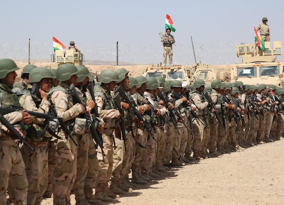 Peshmerga soldiers with 2nd Battalion, 1st Regional Guard Brigade, stand in formation during the Modern Brigade Course 2 graduation ceremony at the Menila Training Center, Iraq, July 28, 2016. Representatives from the U.S. Army, which provided equipment, and the Coalition trainers who taught the course attended the graduation to show their support for the battalion. The building partner capacity mission aims to increase the security capacity of local forces fighting the Islamic State of Iraq and the Levant. (U.S. Army photo by Sgt. Kalie Jones/Released)