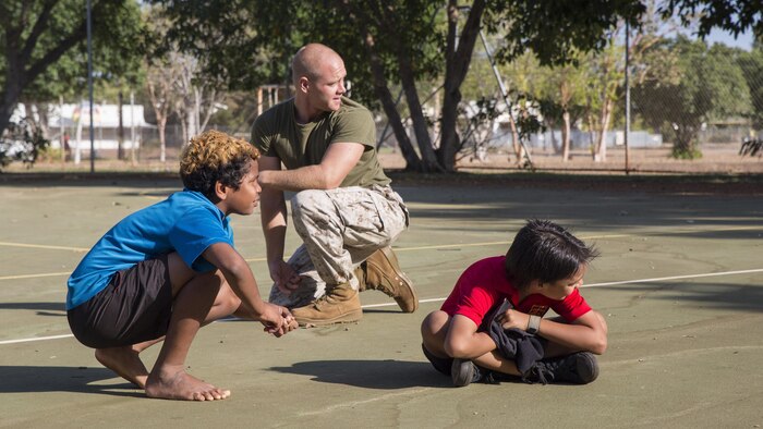 U.S. Marine Corps Cpl. Landis Lied, an embarkation and logistics specialist assigned to Marine Fighter Attack Squadron 122, plays Red Red Bob, a version of the game “tag”, with students at MacFarlane Primary School Katherine, Northern Territory, Australia, Sept.1, 2016. Invited by the school every iteration of Southern Frontier, a three week unit level training conducted by U.S. Marines  at Royal Australian Air Force Base Tindal, Marines mentor, teach and provide role models to the students. With a student population of 92 percent indigenous, students are provided a consolidated education in literacy, numeracy, respect and behavior management.