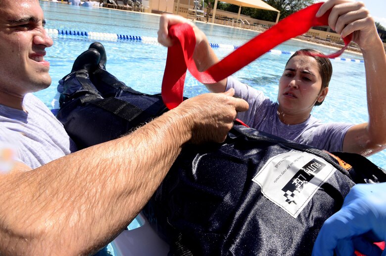 Emergency medical technicians assigned to Eglin Air Force Base, Fla., rescue a simulated drowning victim during the 2016 EMT Rodeo Aug. 26, 2016 at Cannon Air Force Base, N.M. Cannon’s EMT Rodeo tests the skills of medical professionals from across the Air Force through a series of innovative, high-pressure scenarios. (U.S. Air Force photo by Tech. Sgt. Manuel J. Martinez)