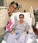 Texas Army National Guard Spc. Brittany Reppond (right), with the 197th Special Troops Support Company based out of Camp Bullis, poses for a photo with Arthur Corenblith at the Methodist Specialty and Transplant Hospital in San Antonio, Feb. 18. 