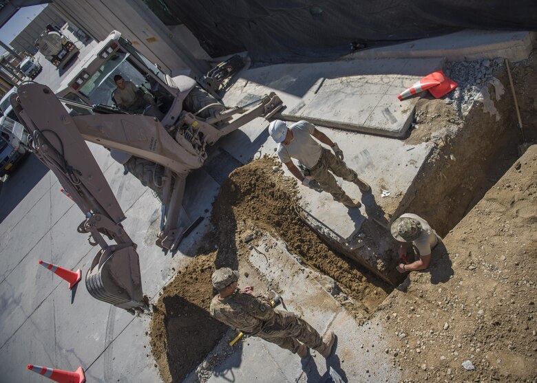 The 455th Expeditionary Civil Engineer Squadron pavement and equipment technicians, otherwise known as “Dirt Boys”, construct a new drainage system, Bagram Airfield, Afghanistan, Sept. 7, 2016. The system will be used to collect excess water and precipitation. (U.S. Air Force photo by Senior Airman Justyn M. Freeman)