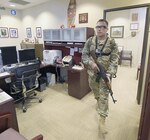 A U.S. Army South Soldier role-playing as an active shooter searches for his next target at the command’s headquarters during an exercise at Fort Sam Houston Sept. 1.