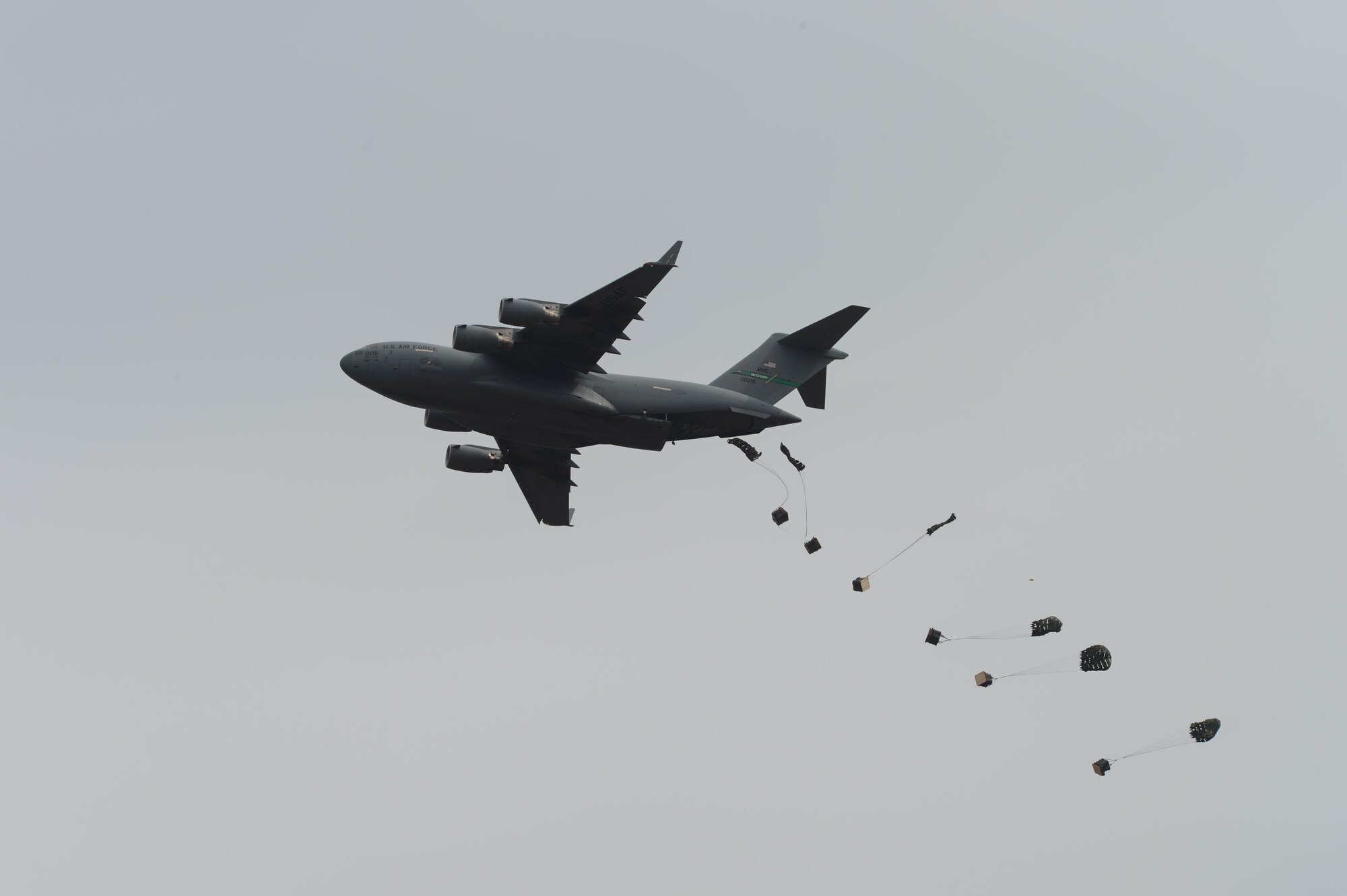 A C-17 Globemaster III performs an air drop Aug. 8, 2016, during the JBLM Airshow and Warrior Expo at Joint Base Lewis-McChord, Wash. The C-17 performed in the airshow to demonstrate the aircraft’s airdrop and maneuverability capabilities. (U.S. Air Force photo/Senior Airman Divine Cox) 